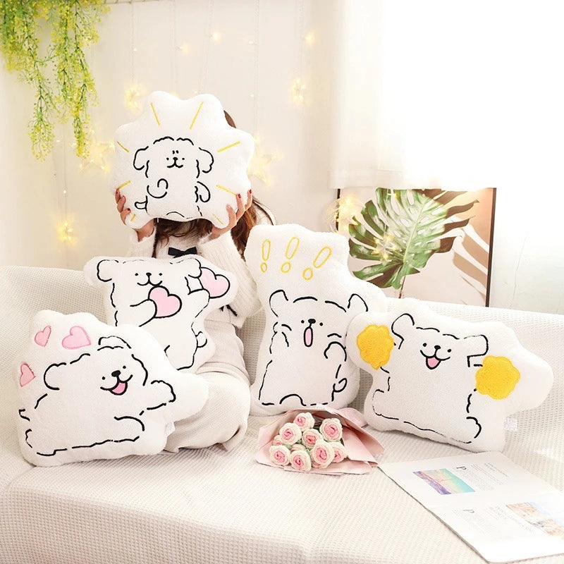 multiple cartoon puppy cushions with love hearts and pom-poms