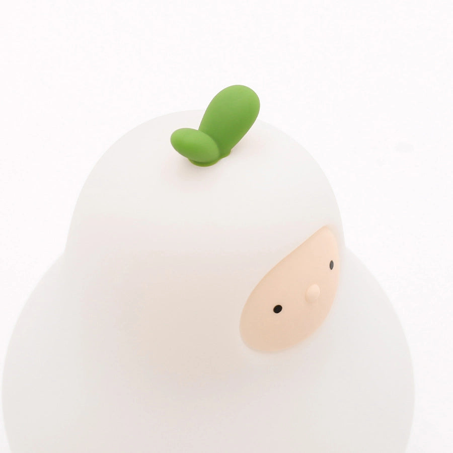 a white silicone cartoon pear night light