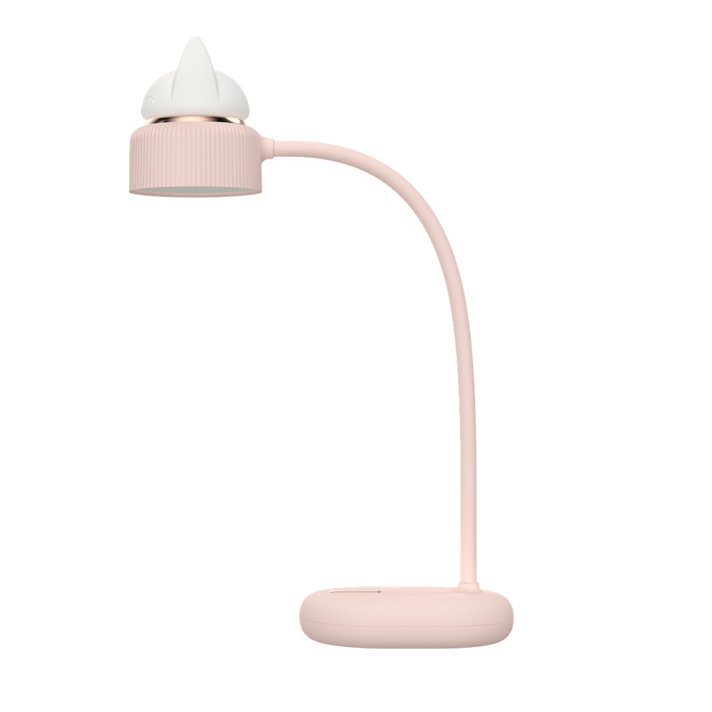 a pink desk lamp with a bendable neck, directional light and silicone kitten ear night light