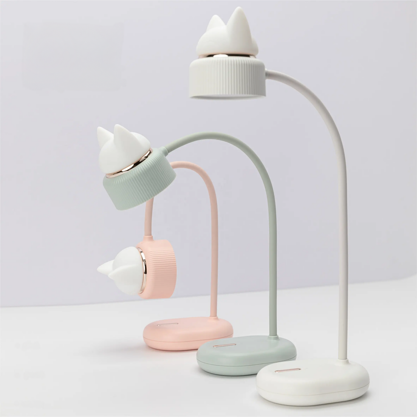 pink, blue, and white desk lamps with bendable necks, directional lights, and silicone kitten ear night lights