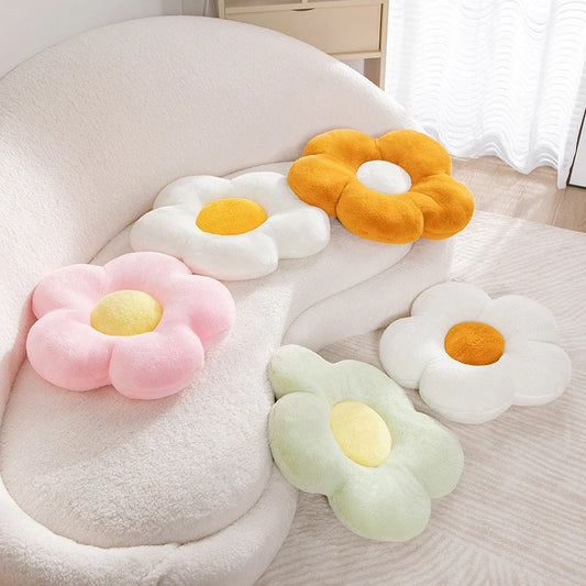 multiple colours of pastel daisy cushions on a couch