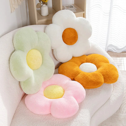 multiple colours of pastel daisy cushions on a couch