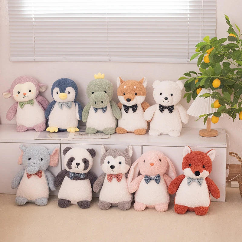 a collection of animal soft toys wearing bow ties