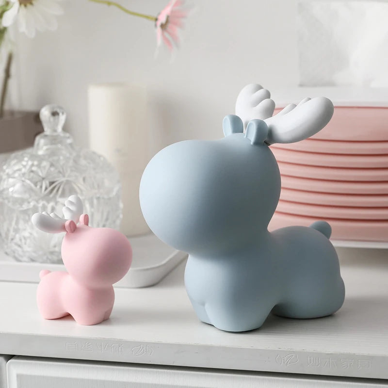 a small pink elk piggy bank and extra large blue elk piggy bank