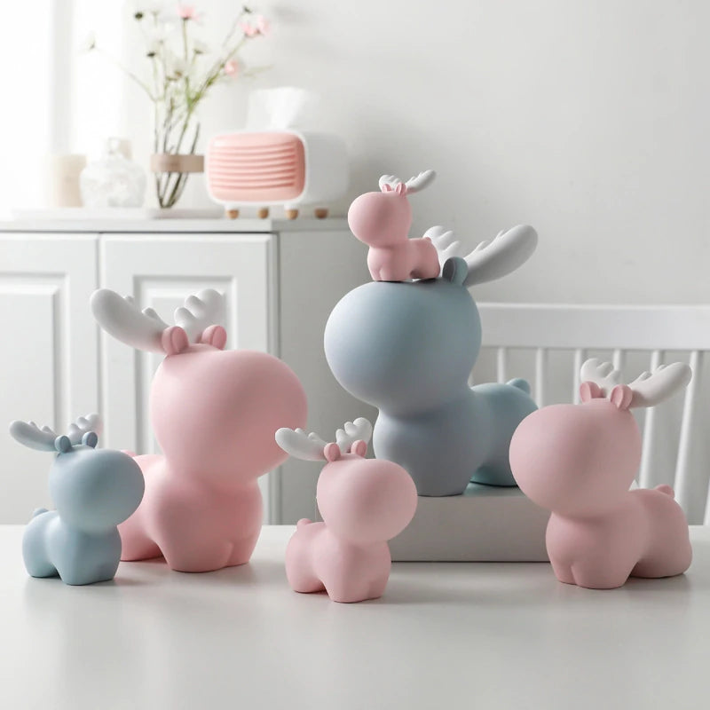 multiple blue and pink elk piggy banks of various sizes