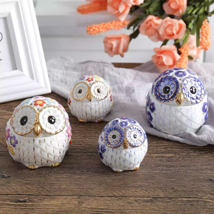 blue and white ceramic owl incense holders with colourful flower patterns