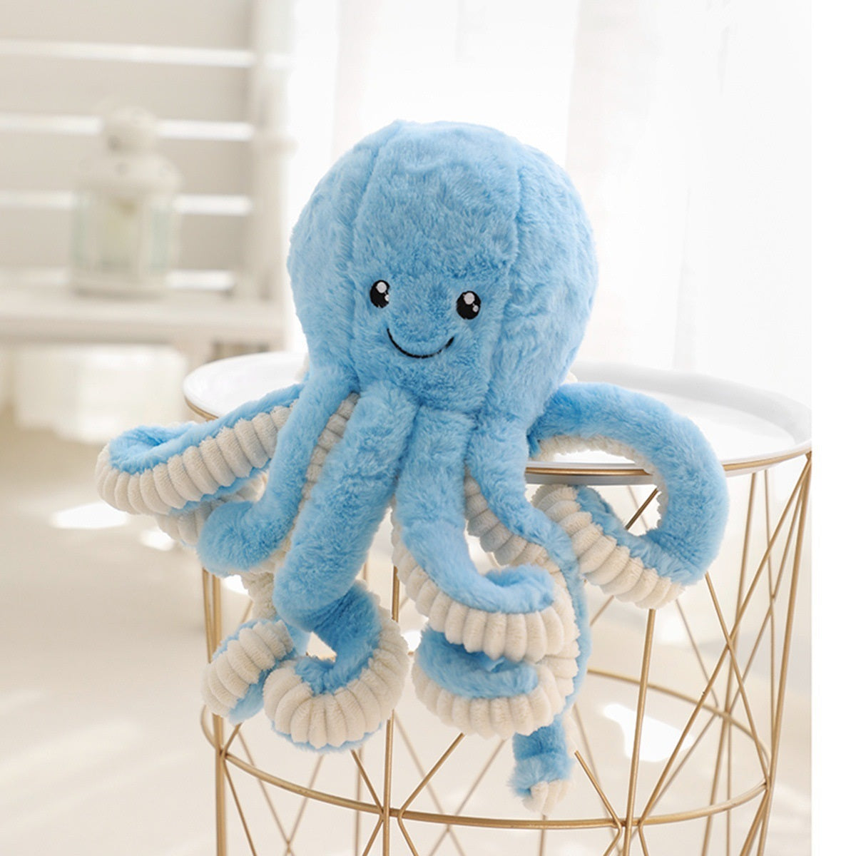 a pastel blue octopus soft toy