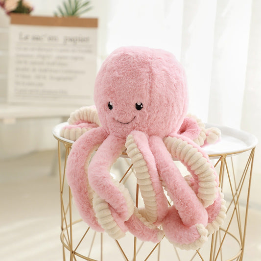 a pastel pink octopus soft toy