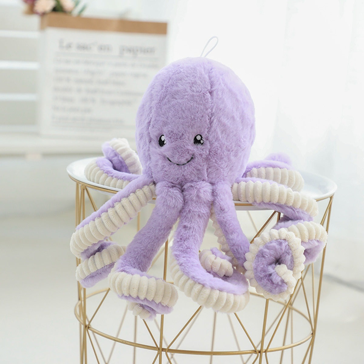 a pastel purple octopus soft toy